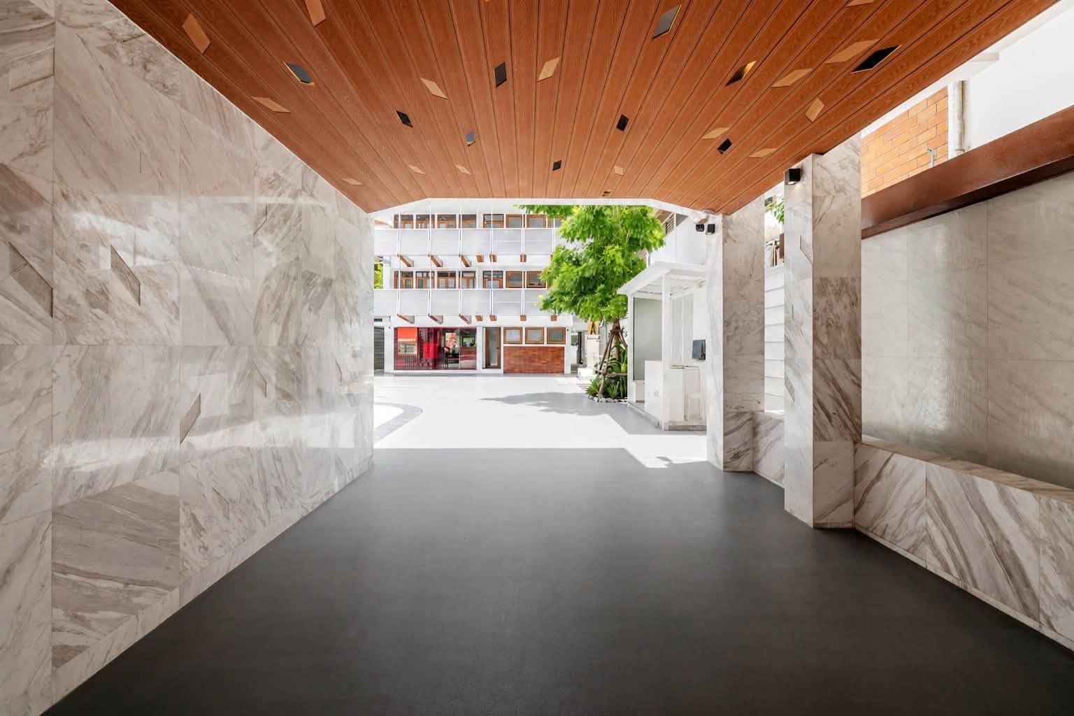 Open retail interior with natural light and warm timber ceiling details